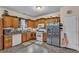 Functional kitchen with ample cabinets, stainless steel refrigerator, and tiled backsplash at 8034 Bradshaw Ct, Douglasville, GA 30134