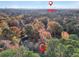 Scenic aerial view of the neighborhood with beautiful fall foliage and glimpses of the city skyline in the distance at 1482 N Crossing Ne Cir, Atlanta, GA 30329