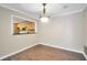 Dining room with wood floors, neutral walls, and chandelier at 1482 N Crossing Ne Cir, Atlanta, GA 30329