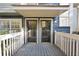 Charming front porch with double doors, painted blue floor and white railings at 1482 N Crossing Ne Cir, Atlanta, GA 30329