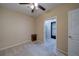 Comfortable bedroom with a ceiling fan and carpeted floors, with an attached closet at 322 Kells Ct, Woodstock, GA 30188