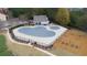 Aerial view highlighting the community pool and playground area, perfect for recreation and Gathering fun at 322 Kells Ct, Woodstock, GA 30188