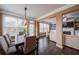 The dining area has lots of natural light and hardwood floors that flow through the open living space at 322 Kells Ct, Woodstock, GA 30188