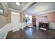 Inviting foyer featuring hardwood floors, wainscoting, and a charming decor that creates a warm and welcoming atmosphere at 322 Kells Ct, Woodstock, GA 30188