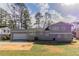 Back exterior of gray brick house with two car garage at 4124 Casa Loma Dr, Decatur, GA 30034