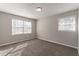 This bedroom features two windows, neutral walls, and carpet flooring at 4124 Casa Loma Dr, Decatur, GA 30034