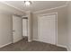 This bedroom features neutral walls, carpet flooring and double door closet at 4124 Casa Loma Dr, Decatur, GA 30034