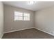 This bedroom features a window and neutral walls with carpet flooring at 4124 Casa Loma Dr, Decatur, GA 30034