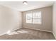 This bedroom features a window, neutral walls, and carpet flooring at 4124 Casa Loma Dr, Decatur, GA 30034