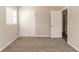 Bedroom with carpet floors, double door closet, and large window at 4124 Casa Loma Dr, Decatur, GA 30034