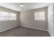 Carpeted bedroom featuring a closet and two windows, providing ample natural light at 4124 Casa Loma Dr, Decatur, GA 30034