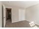 Bright bedroom with neutral walls, carpet floors, and a double-door closet at 4124 Casa Loma Dr, Decatur, GA 30034