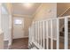 Bright entryway features a staircase with white railing and wood-look flooring at 4124 Casa Loma Dr, Decatur, GA 30034