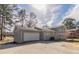 Side exterior of a home with a driveway and attached garage at 4124 Casa Loma Dr, Decatur, GA 30034