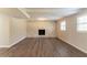 Spacious living room featuring a stone fireplace, light walls, and wood-look flooring at 4124 Casa Loma Dr, Decatur, GA 30034