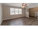 Bright living room featuring wood floors, a ceiling fan, and lots of natural light at 4124 Casa Loma Dr, Decatur, GA 30034