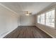 Spacious living room with hardwood floors, a ceiling fan, and large windows at 4124 Casa Loma Dr, Decatur, GA 30034