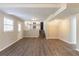 Open concept living space with wood-look floors, staircase, and view of the kitchen at 4124 Casa Loma Dr, Decatur, GA 30034