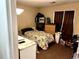 Small bedroom featuring a dinosaur themed bedspread, a dresser, and a side table at 6473 Bedford Ln, Lithonia, GA 30058