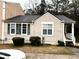 Charming single-story home featuring a cozy front porch and well-maintained landscaping at 6473 Bedford Ln, Lithonia, GA 30058