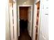 Hallway view featuring white doors and tan walls that lead to rooms in the home at 6473 Bedford Ln, Lithonia, GA 30058