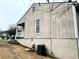 Exterior side view shows AC unit and gas meter on the side of the home at 6473 Bedford Ln, Lithonia, GA 30058