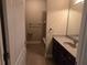 Well-maintained bathroom with a shower-tub combo, vanity, and neutral decor at 2110 Retreat Haven Ln, Dacula, GA 30019