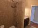 Shower-tub combo with neutral tiling and a single vanity in the bathroom at 2110 Retreat Haven Ln, Dacula, GA 30019