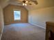 Finished bonus room with neutral walls and carpet at 2110 Retreat Haven Ln, Dacula, GA 30019