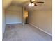Finished bonus room with neutral walls and carpet at 2110 Retreat Haven Ln, Dacula, GA 30019