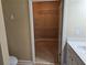 Walk-in closet with shelving and ample storage space, adjacent to the bathroom at 2110 Retreat Haven Ln, Dacula, GA 30019