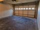 Attached garage with concrete floor and automatic door at 2110 Retreat Haven Ln, Dacula, GA 30019