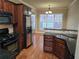 Kitchen featuring granite countertops, stainless steel appliances and dark wood cabinetry at 2110 Retreat Haven Ln, Dacula, GA 30019