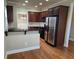 Kitchen featuring granite countertops, stainless steel appliances and dark wood cabinetry at 2110 Retreat Haven Ln, Dacula, GA 30019