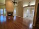 Spacious living room with a stone fireplace, hardwood floors and archways at 2110 Retreat Haven Ln, Dacula, GA 30019