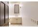Powder room featuring a vanity with updated fixtures, a framed mirror, and a tiled floor at 3131 Nw Slaton Nw Dr # 24, Atlanta, GA 30305