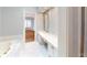 Elegant bathroom with a soaking tub, vanity and white tiling at 3131 Nw Slaton Nw Dr # 24, Atlanta, GA 30305