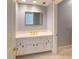 Bathroom featuring a white vanity, a large mirror and neutral tile flooring at 3131 Nw Slaton Nw Dr # 24, Atlanta, GA 30305