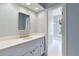 Bright bathroom with a white vanity, gold hardware, and a view into the walk-in closet at 3131 Nw Slaton Nw Dr # 24, Atlanta, GA 30305