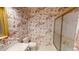 Bathroom featuring gold-trimmed shower and vanity with patterned wallpaper at 3131 Nw Slaton Nw Dr # 24, Atlanta, GA 30305