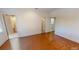 Large bedroom with wood floors and views of a connecting bathroom and laundry room at 3131 Nw Slaton Nw Dr # 24, Atlanta, GA 30305