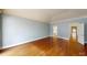 Spacious bedroom featuring hardwood floors, crown molding, and a doorway to an ensuite bathroom at 3131 Nw Slaton Nw Dr # 24, Atlanta, GA 30305