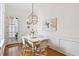 Bright dining room with hardwood floors, white wainscoting, and stylish pendant lighting at 3131 Nw Slaton Nw Dr # 24, Atlanta, GA 30305