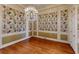 The dining room boasts hardwood floors, decorative wallpaper, and a stunning crystal chandelier at 3131 Nw Slaton Nw Dr # 24, Atlanta, GA 30305