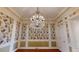 Ornate dining room featuring a chandelier, rich wallpaper, and detailed trim at 3131 Nw Slaton Nw Dr # 24, Atlanta, GA 30305