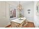 Cozy dining area featuring natural light from the window and a decorative pendant light at 3131 Nw Slaton Nw Dr # 24, Atlanta, GA 30305