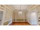Elegant dining room with chandelier, wallpaper, and rich hardwood floors at 3131 Nw Slaton Nw Dr # 24, Atlanta, GA 30305