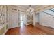 Elegant hallway features hardwood floors, chandelier, staircase and decorative wallpaper at 3131 Nw Slaton Nw Dr # 24, Atlanta, GA 30305