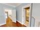 Light and airy hallway with hardwood floors leading to the bedrooms and bathrooms at 3131 Nw Slaton Nw Dr # 24, Atlanta, GA 30305