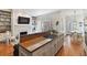 Open kitchen and dining area featuring granite countertops and stainless steel gas range at 3131 Nw Slaton Nw Dr # 24, Atlanta, GA 30305